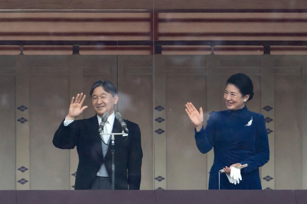 Japan's Emperor Naruhito (L) and Empress Masako wave to well-wishers on the balcony of the Imperial Palace in Tokyo on February 23, 2024. Emperor Naruhito celebrated his 64th birthday. (Tomohiro Ohsumi/POOL/AFP)