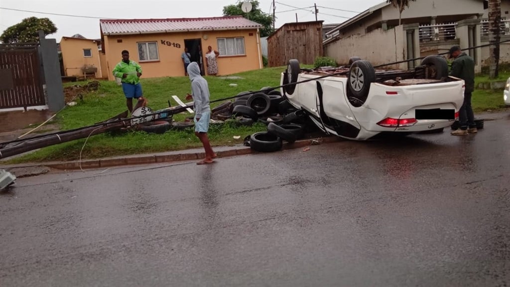 A car veered off the road and crashed into a street pole. 