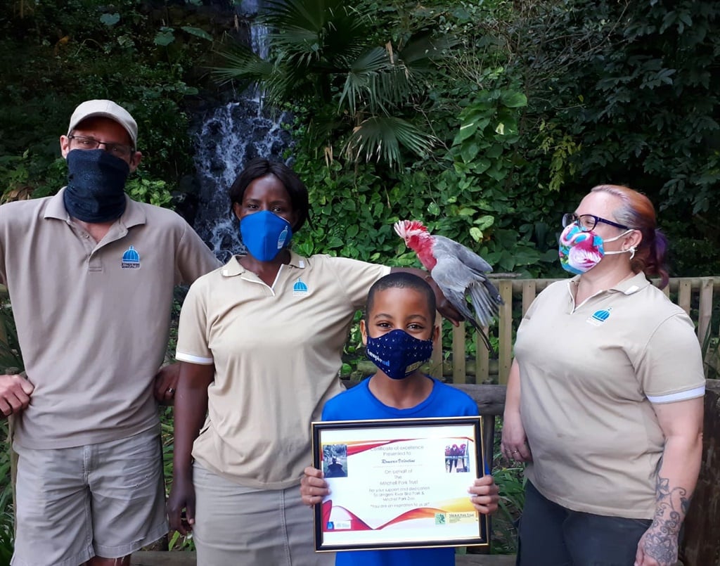 Romario Valentine with staff at the Umgeni River Bird Park. 