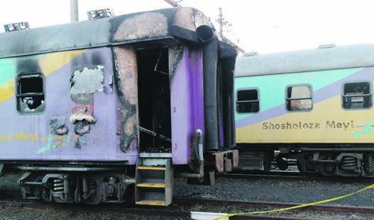 A homeless man set train carriages on fire in Bloemfontein after a fight over poking. ­                Photo by Kabelo Tlhabanelo