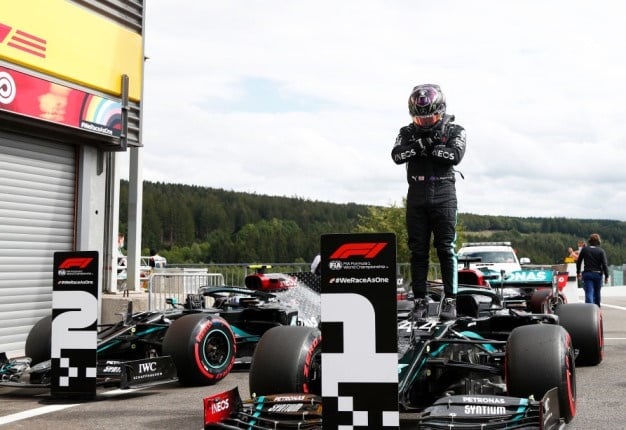 Pole position qualifier Lewis Hamilton of Great Britain and Mercedes GP celebrates in parc ferme during qualifying for the F1 Grand Prix of Belgium. Image: Francois Lenoi Getty