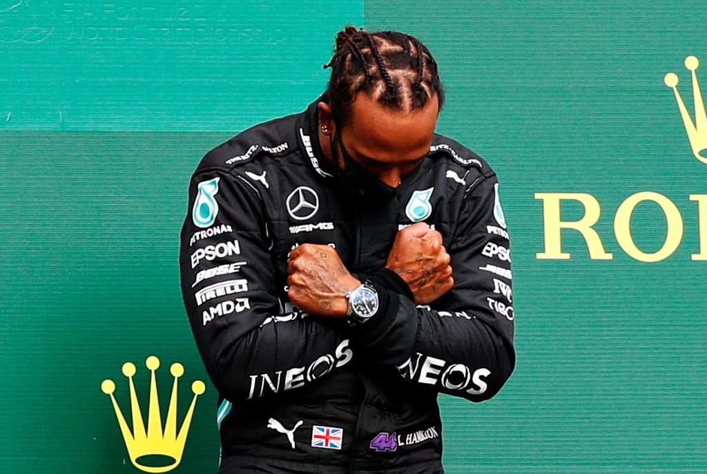 Race winner Lewis Hamilton celebrates on the podium with a tribute to the late Chadwick Boseman during the F1 Grand Prix of Belgium.Image: Francois Lenoir / Getty. 