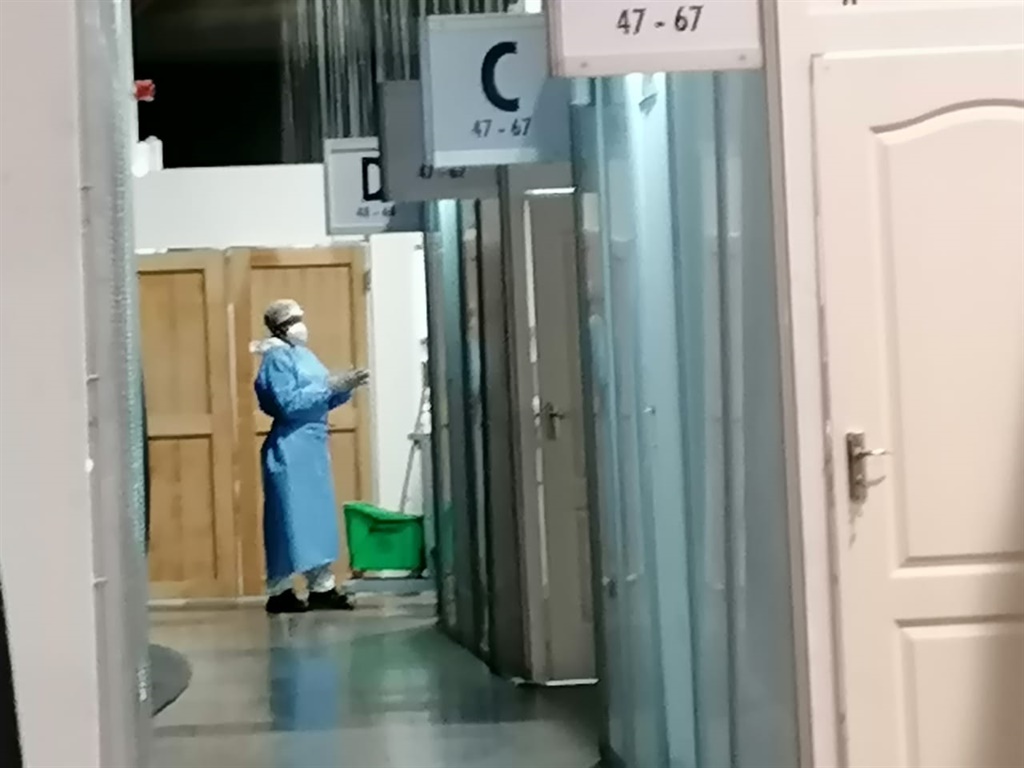 A cleaner at the Nasrec field hospital (News24/Aza