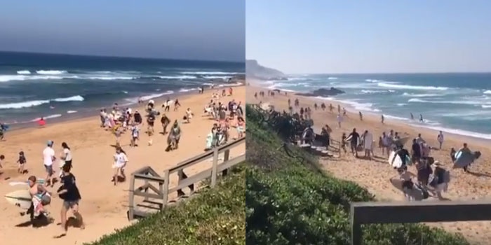 Beachgoers flee from the authorities at a Durban beach. (What's on Durban, Facebook)