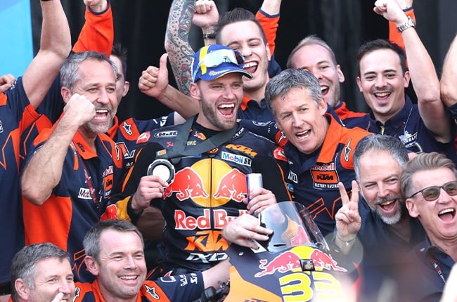 Brad Binder with his Red Bull KTM Factory team in the 2023 MotoGP season (Gold & Goose / Red Bull Content Pool)