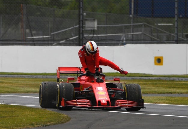 Sebastian Vettel of Germany driving the (5) Scuderia Ferrari SF1000 climbs out of his car after stopping on track during practice for the F1 70th Anniversary Grand Prix at Silverstone on August 07, 2020 in Northampton, England. (Photo by Rudy Carezzevoli/Getty Images)