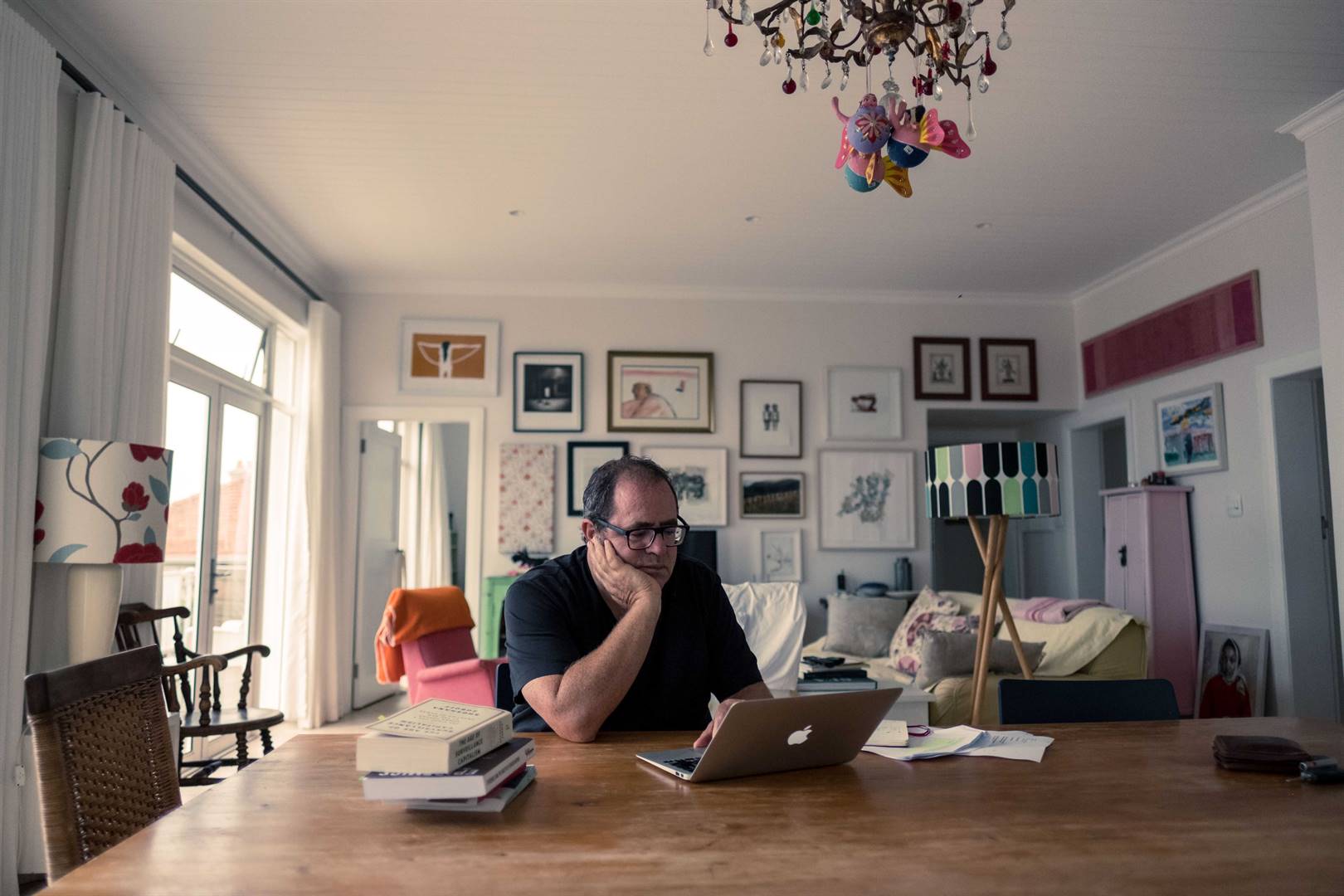 Mark Gevisser working at his home in Kalk Bay, a few years after his break-ins in Johannesburg. Photo: Tommy Trenchard