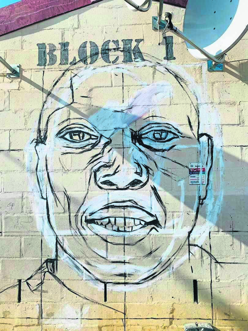 One of the living legends Ndlela Mavungavunga whose face is depicted on the wall in Lwandle Hostel. Mavungavunga is among the seven living legends that are celebrated in the area. PHOTO: UNATHI OBOSE