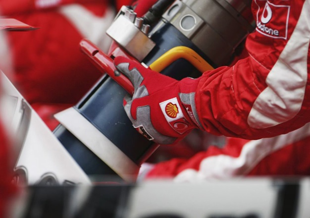 A fuel hose is seen as a Ferrari pit crew practice a pit stop practice after qualifying for the Bahrain Formula One Grand Prix at the Bahrain International Circuit on March 11, 2006 in Sakhir, Bahrain.  (Photo by Clive Mason/Getty Images)
