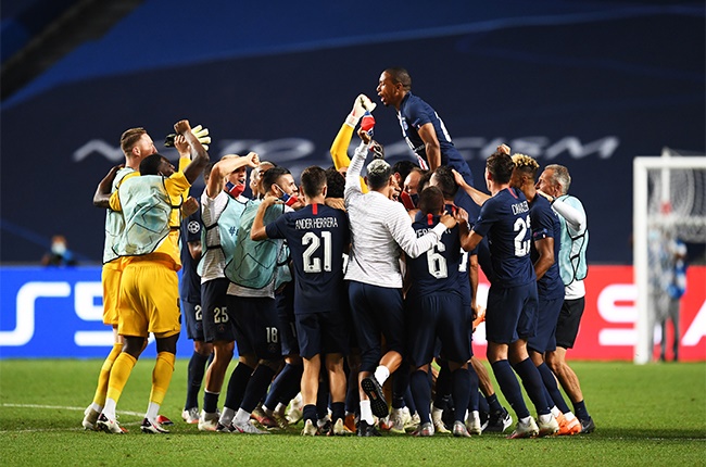 The PSG team celebrate victory after the UEFA Champions League Semi Final match between RB Leipzig and Paris Saint-Germain F.C at Estadio do Sport Lisboa e Benfica on August 18, 2020 in Lisbon, Portugal.