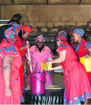Brides learn how to brew umqombothi at the makoti boot camp.