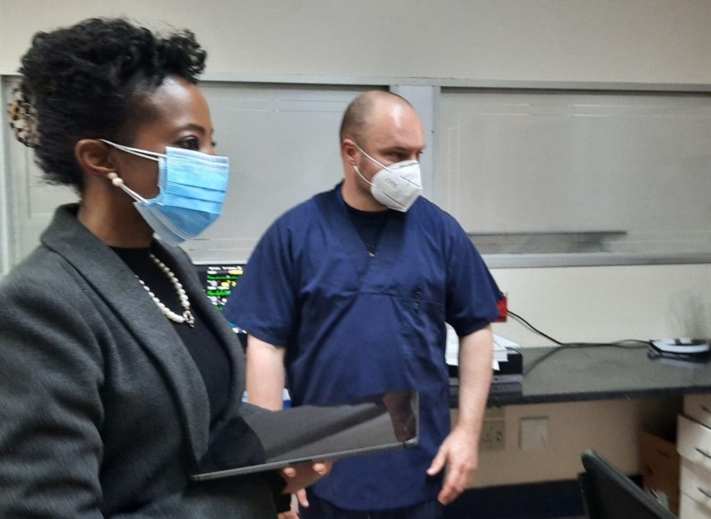Deputy Pubic Protector Advocate Kholeka Gcaleka interacts with a doctor at Charlotte Maxeke Johannesburg Academic Hospital. 