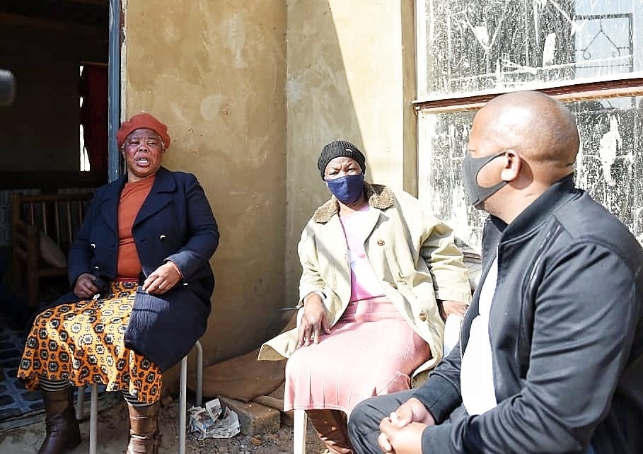 Gogo Khabonina Mkhonza (right) with a relative during Mayor Mzwandile Masina's visit at gogo Mkhonza's house following her attack. Photo by Christopher Moagi