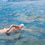 Amber-Rose swims into history books as the youngest female to finish False Bay crossing