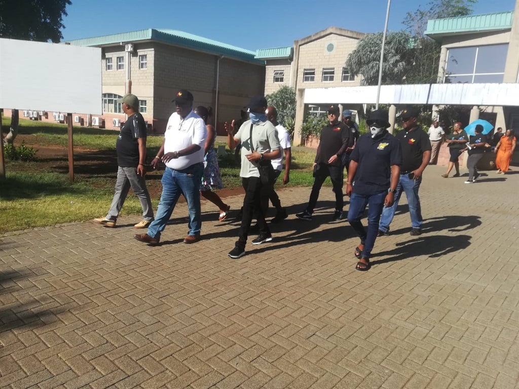The accused in the alleged traffic department syndicate outside court. Photo by Joseph Mokoaledi