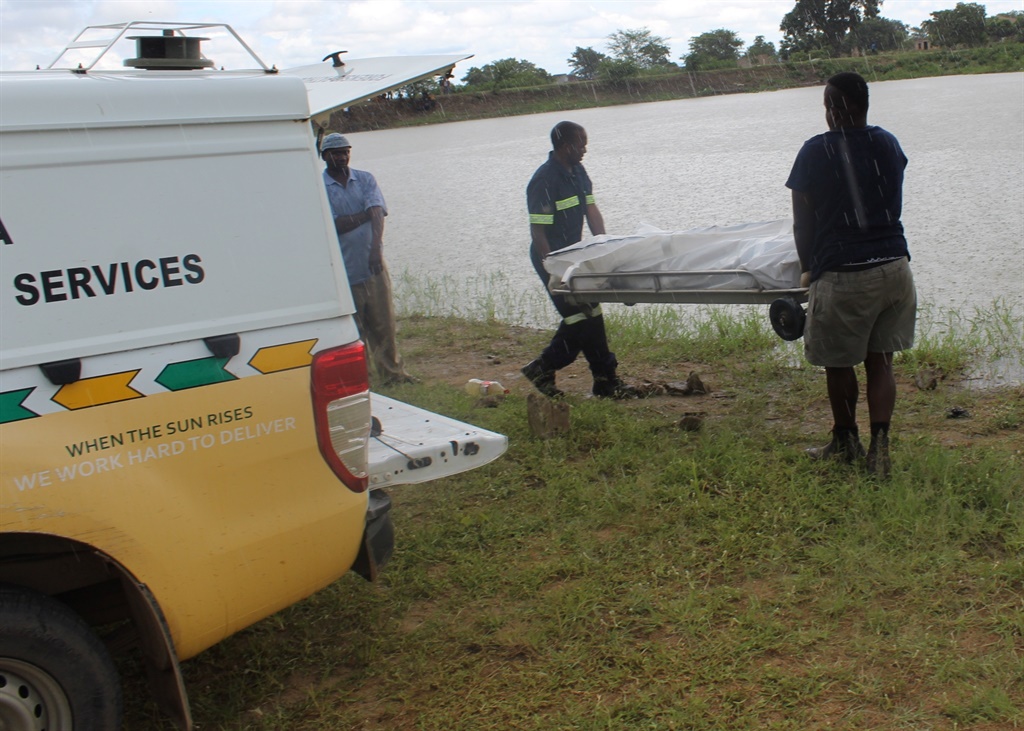 Forensic pathology services collecting lifeless body of Thakgatso Mashile at the river early today.
Photo: Supplied
