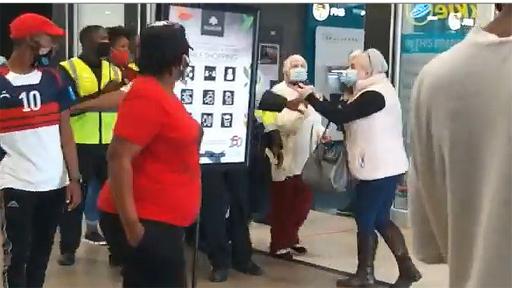 A screenshot showing a shopper pulling a gun on EFF members at a PE mall.