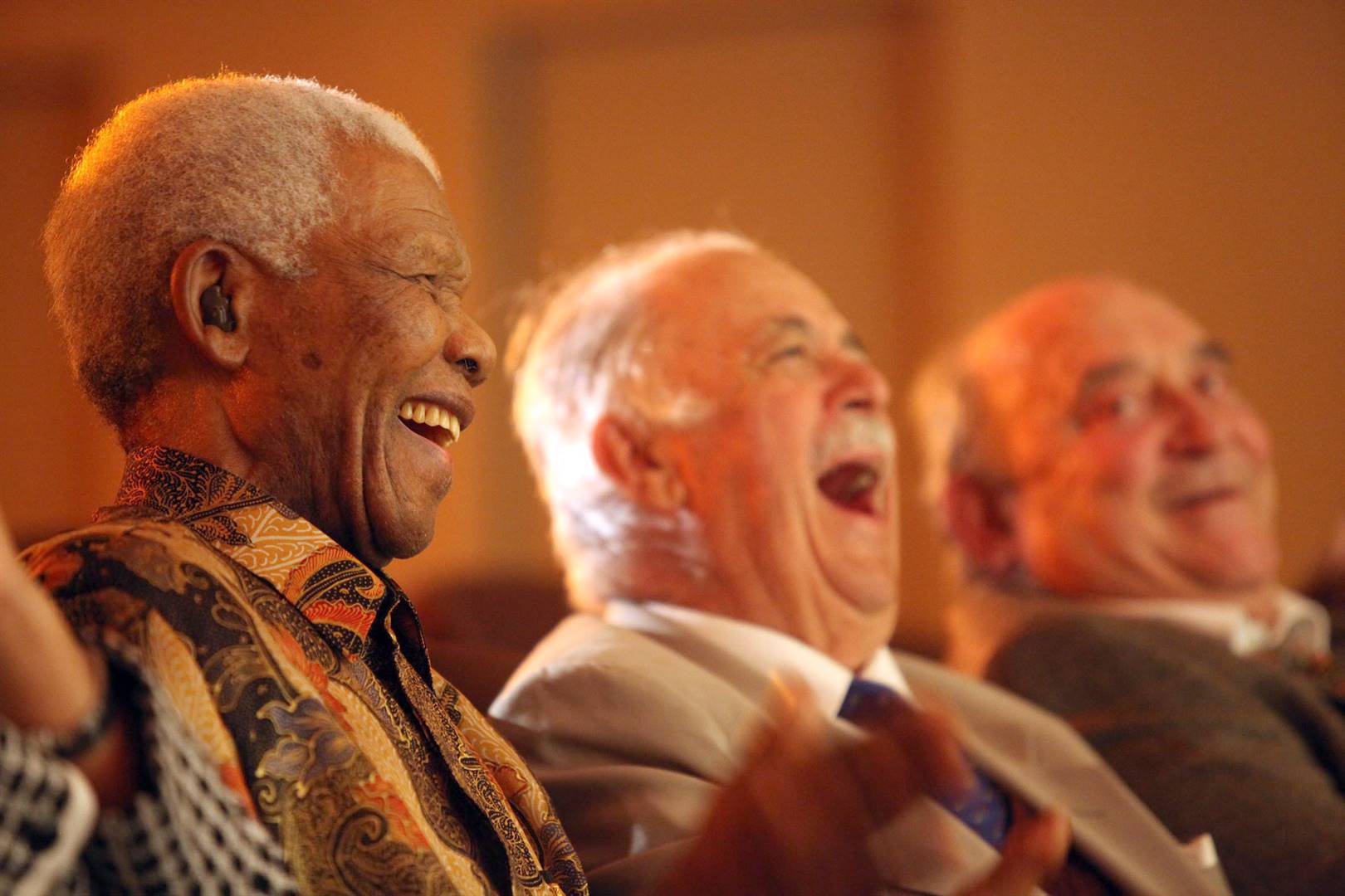 Former president Nelson Mandela, Advocate George Bizos and Denis Goldberg watch the one-person show, The Rivonia Trial, performed by Monde Wani in 2009. Photo: Debbie Yazbek/Nelson Mandela Foundation
