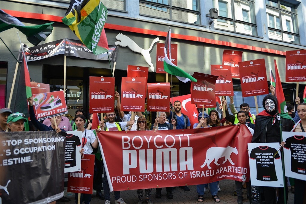 Protesters at a Puma flagship store on Carnaby Street, London. Activists demonstrated against Puma's sponsorship of the Israel Football Association in 2021. (Photo by Thomas Krych/SOPA Images/LightRocket via Getty Images) 