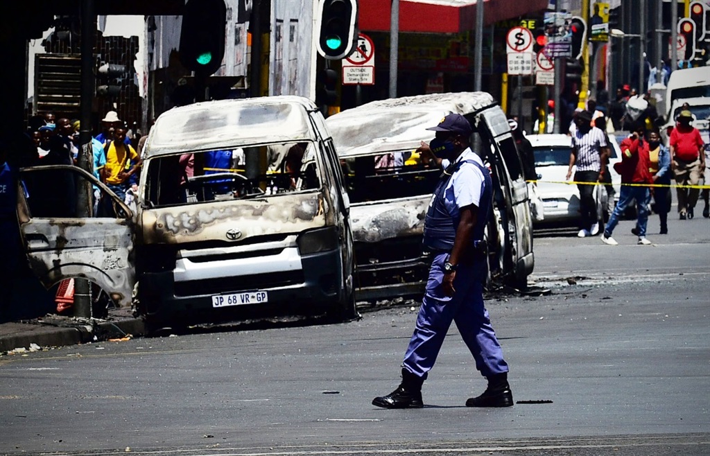 Four minibus taxis have been set alight  and more damaged in Joburg CBD on Saturday morning. Photo by Lucky Morajane