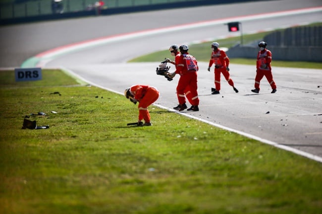 Marshals clear up the debris from the restart crash during the F1 Grand Prix of Tuscany at Mugello Circuit on September 13, 2020 in Scarperia, Italy. (Photo by Peter Fox/Getty Images)