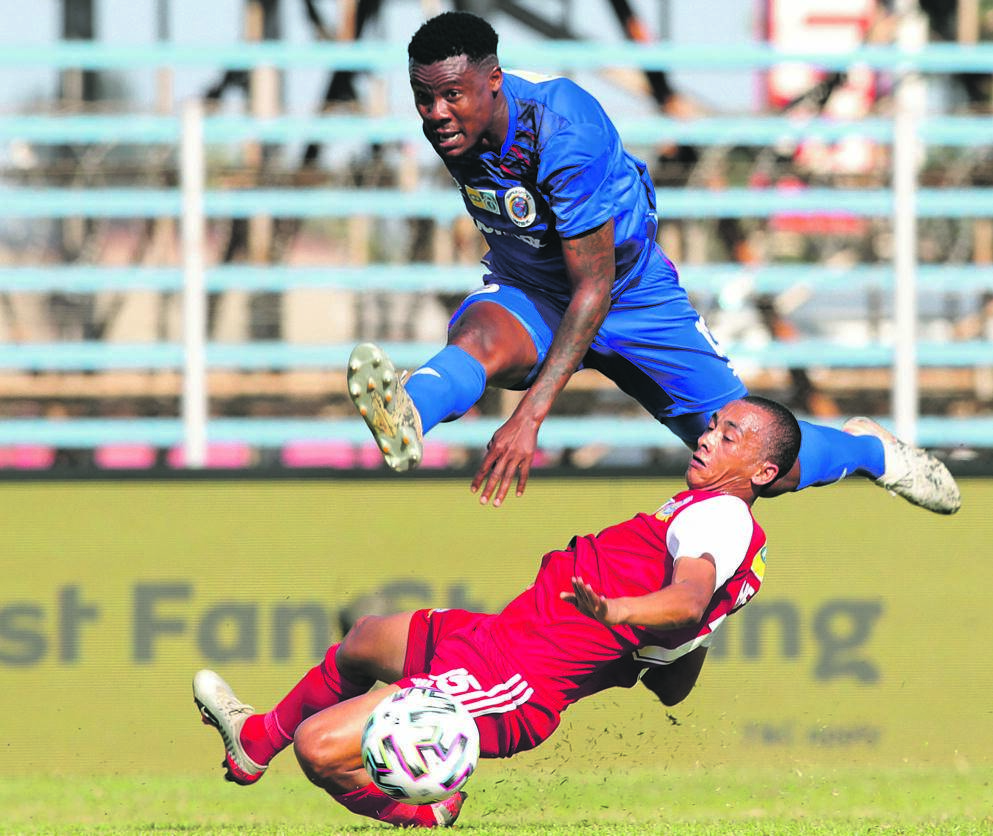 SuperSport United striker Thamsanqa Gabuza is tackled by Brandon Theron of TTM during their MTN8 quarterfinal clash at Thohoyandou Stadium yesterday Picture: Samuel Shivambu / BackpagePix