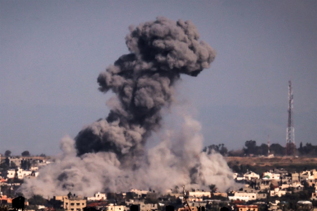This picture taken from Rafah, in the southern Gaza Strip, shows smoke rising over buildings in Khan Yunis during Israeli bombardment on 1 February 2024, as fighting continues between Israel and the Palestinian Hamas group in Gaza.
