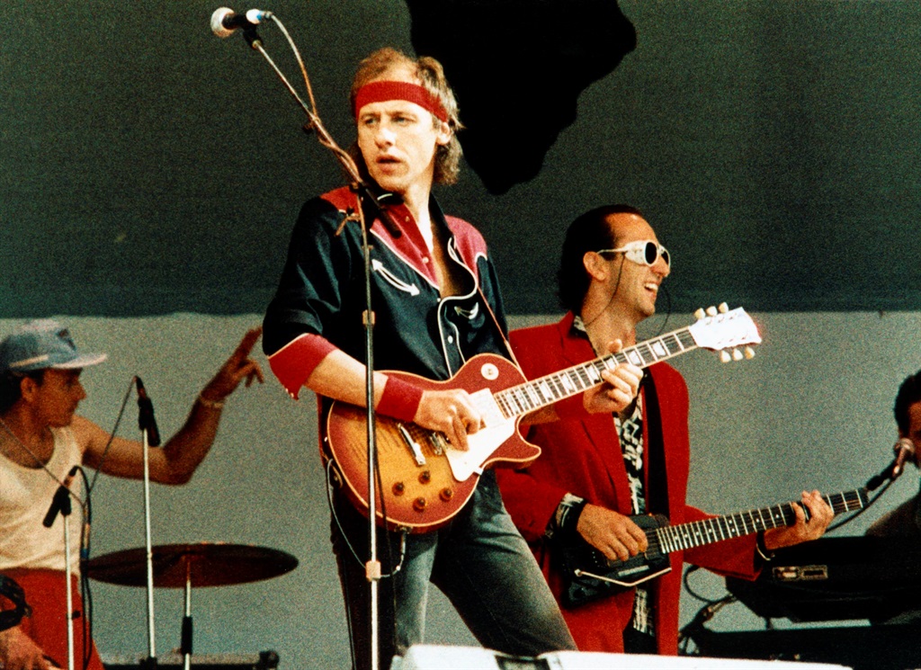 Mark Knopfler performing live onstage at Live Aid,