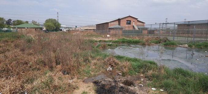 Running sewage from outside Mayibuye Primary School.