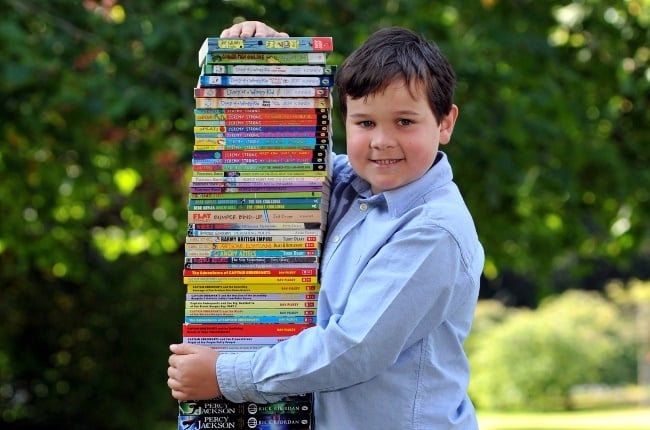 Elijah Fyrne, who turned nine on 17 September, has read 84 books, which stacks up to his height of 1,37m. (Photo: Mikal Ludlow Photography)