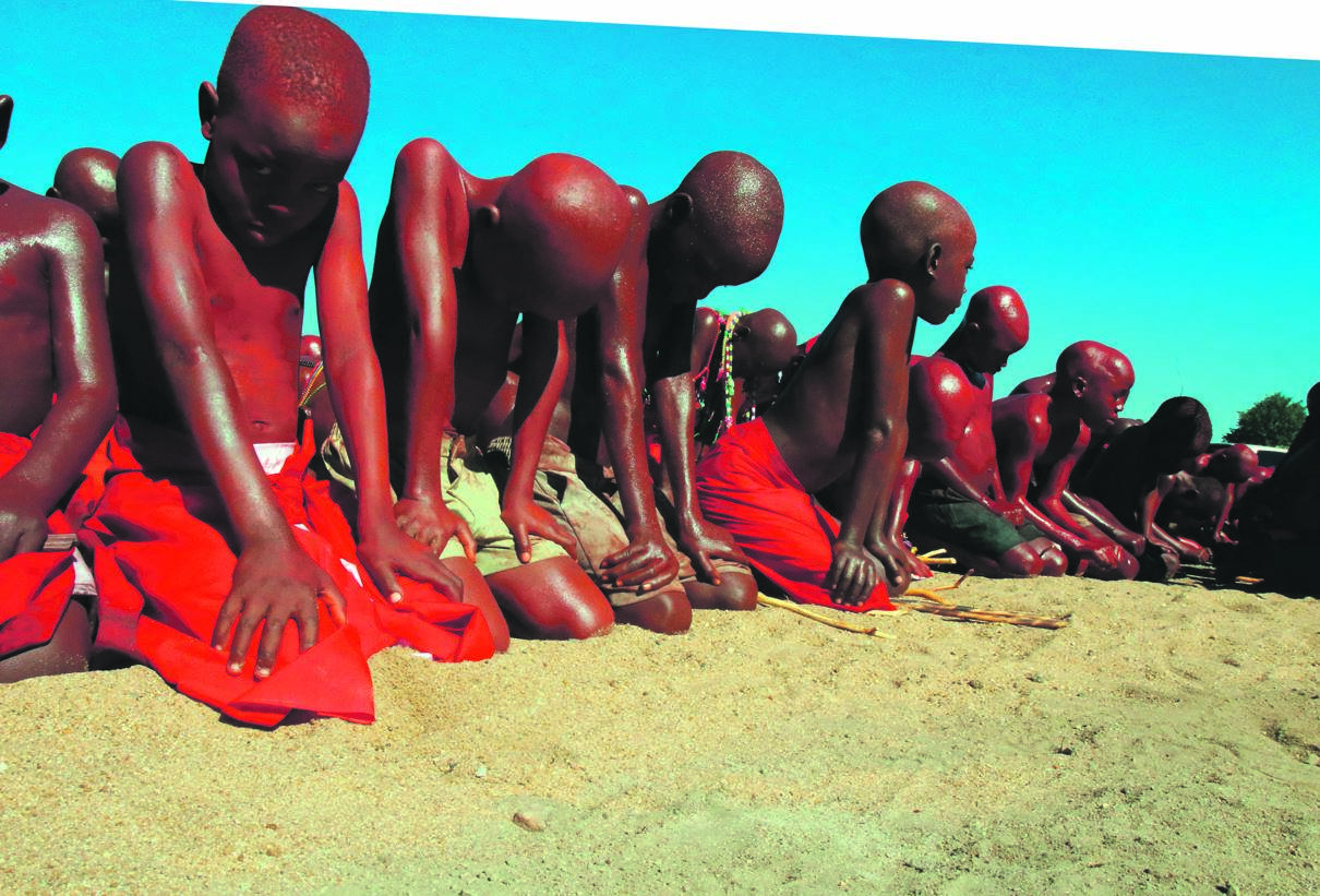 If initiation schools were allowed to open, young initiates would be covered in red clay like these ones from Mpepule in 2018, as they were welcomed back home.             Photo by Gallo Images