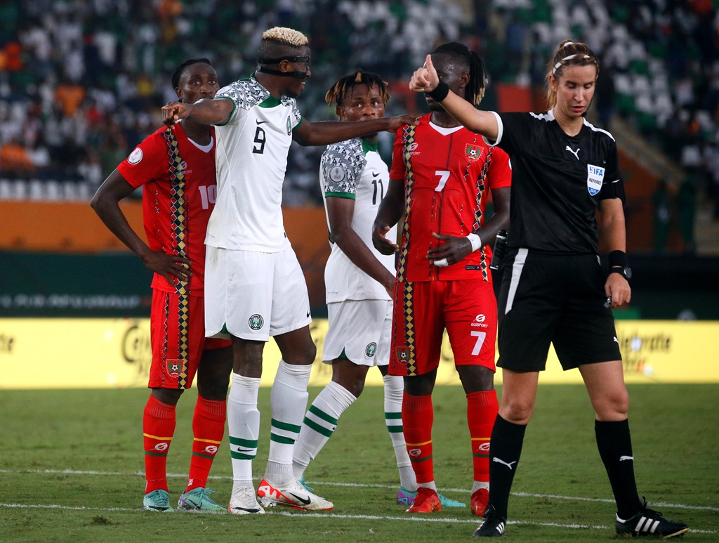 Moroccan referee Bouchra Karboubi lays the ground rules despite protest from Nigeria star Victor Osimhen during the Super Eagles' group match against Guinea-Bissau on 22 January
