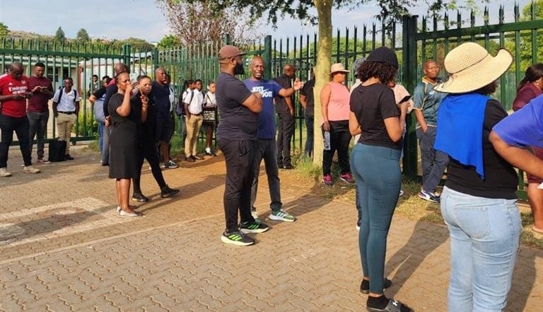 Parents gathered at the entrance of Theresa Park High School in Pretoria North to raise their concerns about the school.