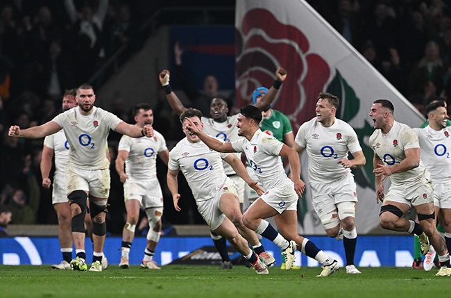 England's Marcus Smith celebrates scoring the winning drop goal against Ireland at Twickenham on 9 March 2024. (Mike Hewitt/Getty Images)