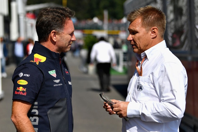 Red Bull Racing Team Principal Christian Horner talks with FIA Race Steward Mika Salo in the Paddock before the Formula One Grand Prix of Belgium at Circuit de Spa-Francorchamps on August 26, 2018 in Spa, Belgium.  (Photo by Dan Mullan/Getty Images)