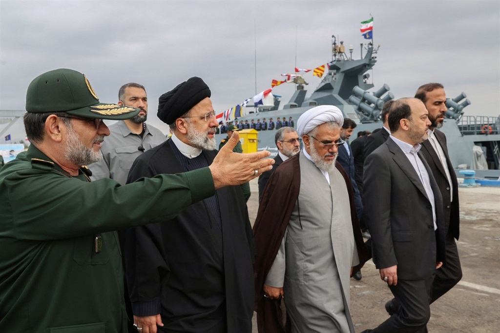 A handout picture made available by the Iranian presidential office on February 2, 2024 shows Iranian President Ebrahim Raisi visiting the Iranian revolutionary guards corps (IRGC) navy base in Bandar Abbas, southern Iran.  