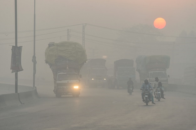 Commuters moving forward in a smoky environment