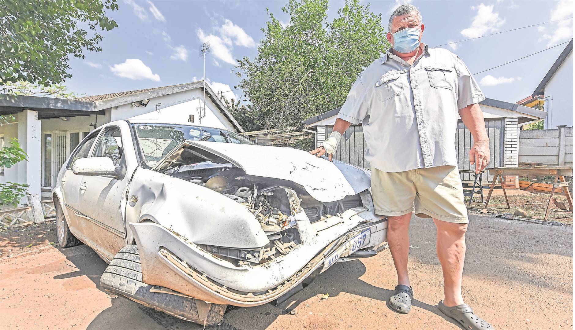 Scottsville resident Michael Stening-Smith standing next to his car, which was written off after the accident in Slangspruit.
