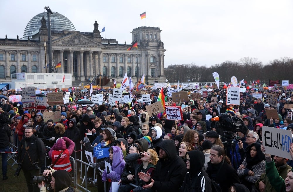 Demonstrators protest against the far-right Alternative for Germany (AfD) party outside the Reichstag building in Berlin, Germany on 3 February 2024.