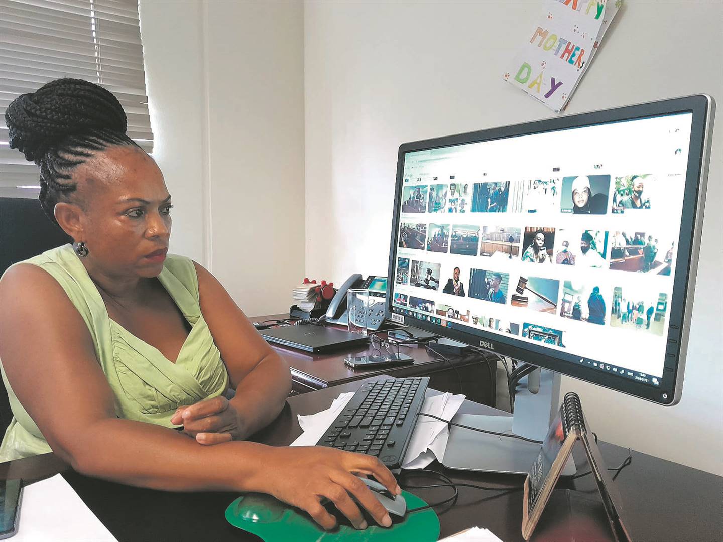 Onthatile Sebati’s paternal aunt, Poppy Sebati, browsing through the online pictures of her niece’s court proceedings