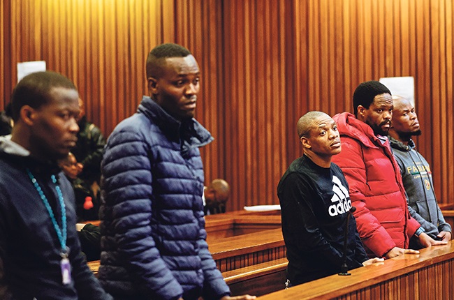 Five accused men in the Senzo Mayiwa murder trial in the dock of the Pretoria High Court on 17 July last year