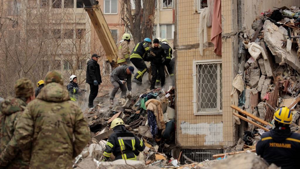 Rescuers work at a heavily damaged multi-storey apartment building, following a Russian drone attack, in Odesa. (Oleksandr Gimanov/AFP)