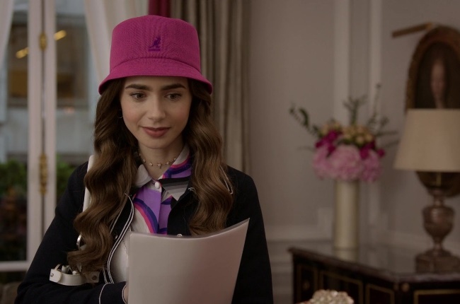 In Episode 7 Emily wore a Pink Kangol Panama bucket hat, which subsequently sent searches for the hat soaring. PHOTO: NETFLIX