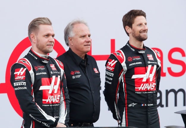 Kevin Magnussen (left) and Romain Grosjean (right) with team owner, Gene Haas (Getty Images)