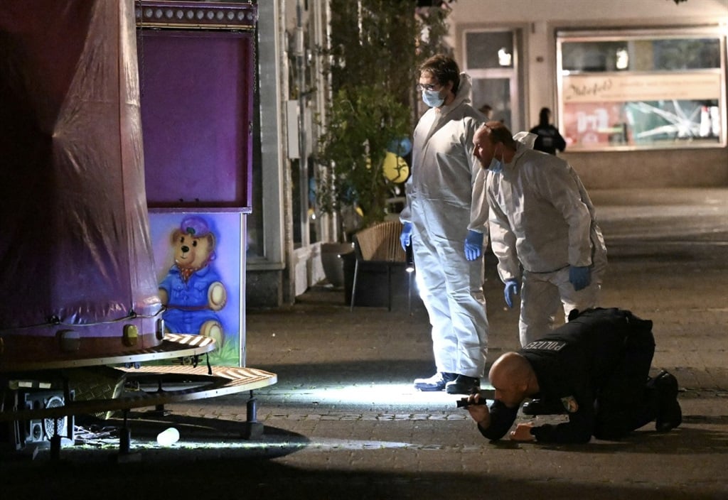 German forensic police inspect the area where at least three people were killed and several injured after a man attacked them with a knife on 23 August 2024 in Solingen, western Germany, as the city celebrated its 650th anniversary. (Ina Fassbender/AFP)