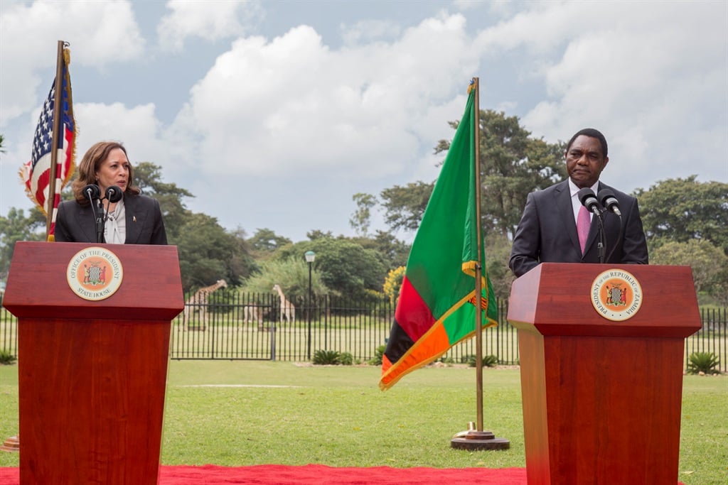 US Vice President Kamala Harris (L) and Zambian President Hakainde Hichilema (R) are seen at the State House in Lusaka on 31 March 2023 during a press conference. Zambian President Hakainde Hichilema asked the United States on Friday to help expedite debt restructuring negotiations with the country's creditors during a visit by Vice President Kamala Harris.