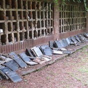 Volunteers working to fix 5 000 plaques on ash walls at cemetery desecrated by vandals