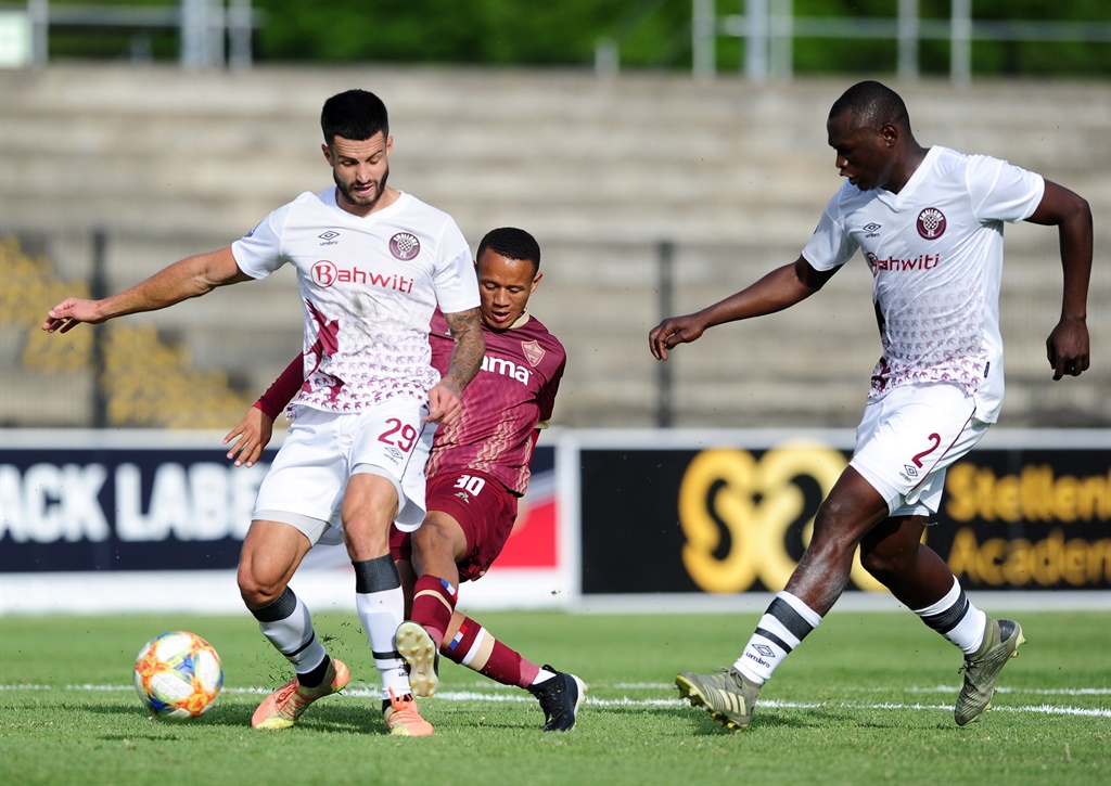 Roy-Keane Avontuur of Stellenbosch FC is tackled by Keegan Ritchie of Swallows FC as he shoots at goal during the DStv Premiership 2020/21 game between Stellenbosch FC and Swallows FC at Danie Craven Stadium in Stellenbosch on 25 October 2020 © Ryan Wilkisky/BackpagePix