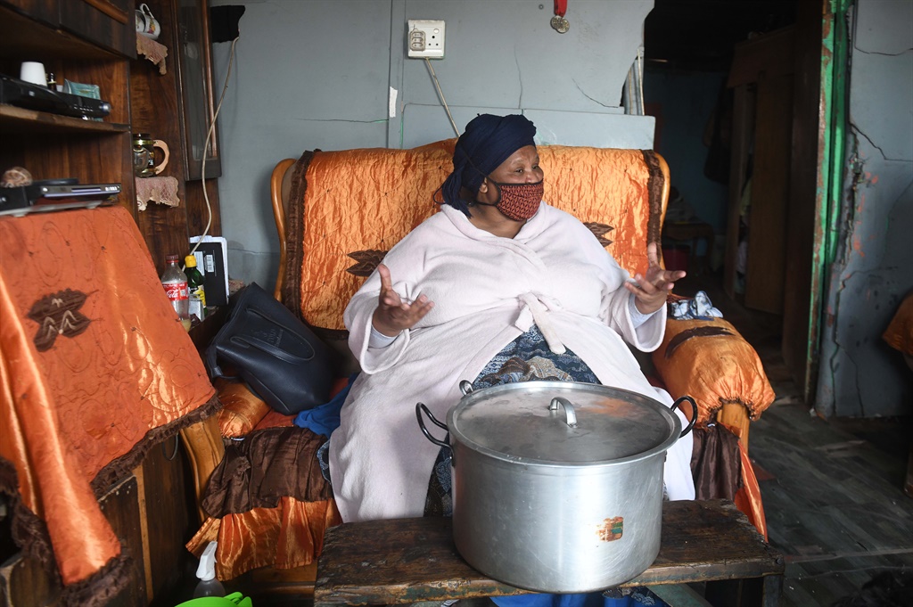 Momma Sheila Botha sits on her ‘throne’ in her home in Sun City, Makhanda. Botha runs a pop-up soup kitchen that feeds roughly 90 children twice a week in the community. Picture: Black Star/Spotlight