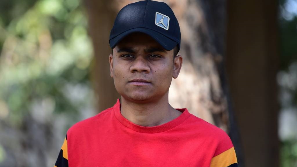 This picture shows apple farmer Sheikh Mohammad Tahir, an Indian national recruited to join the Russian war effort in Ukraine and who then fled Russia after beginning basic training, posing at a park in Ahmedabad. (Sam Panthaky/AFP)